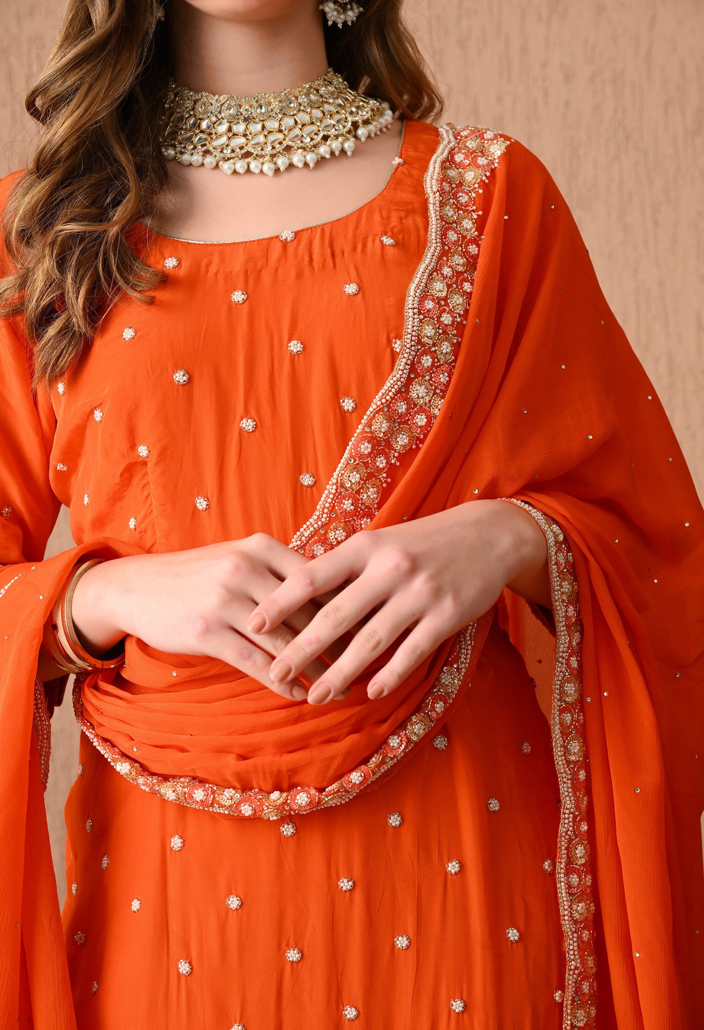 Vibrant Orange Kurta Set with Beautiful Zardozi, Pearl, and Cutdana Work
