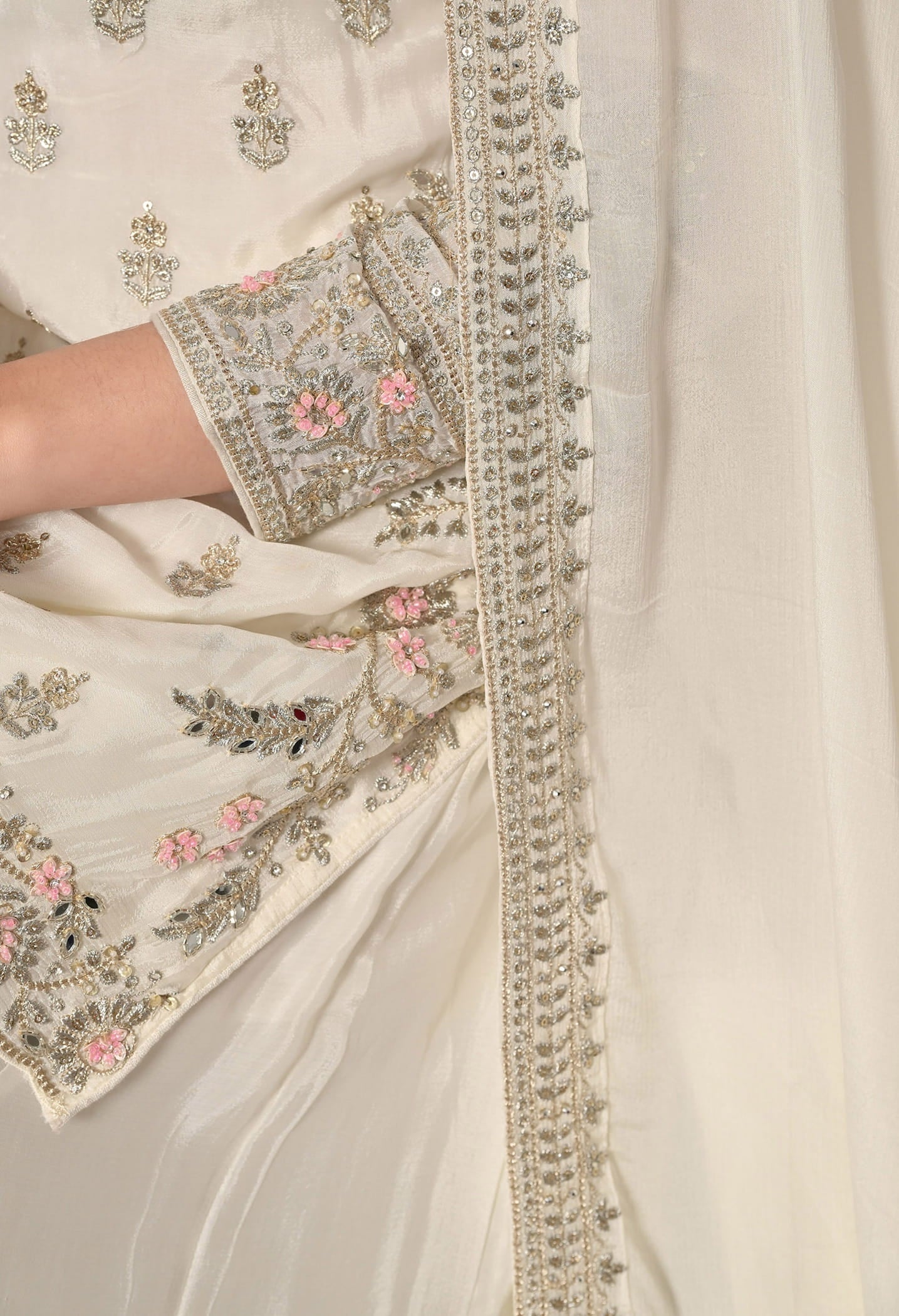 Golden Cream Lehenga Set with Zardozi, Crystal, Sequin, and Mirror Embellishments.