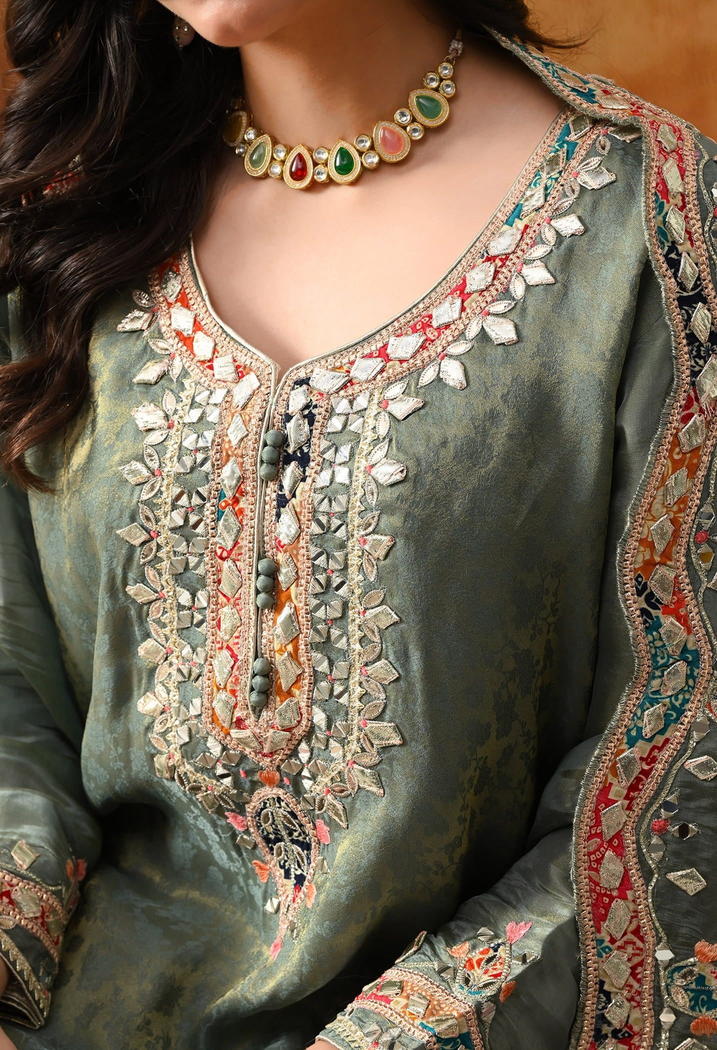 Mint Green Tissue Crepe Sharara Set with intricate gotta, zardozi, applique, thread, and mirror work, paired with a pink and green dupatta