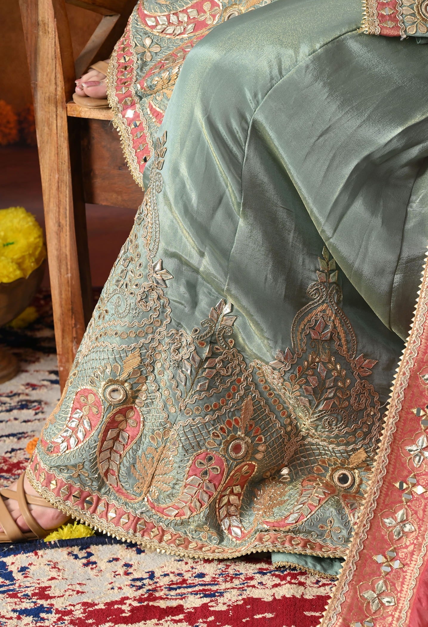 Elegant light blue sharara set in tissue crepe with gotta, zardozi, and mirror work, paired with a contrasting pink Banarasi silk dupatta