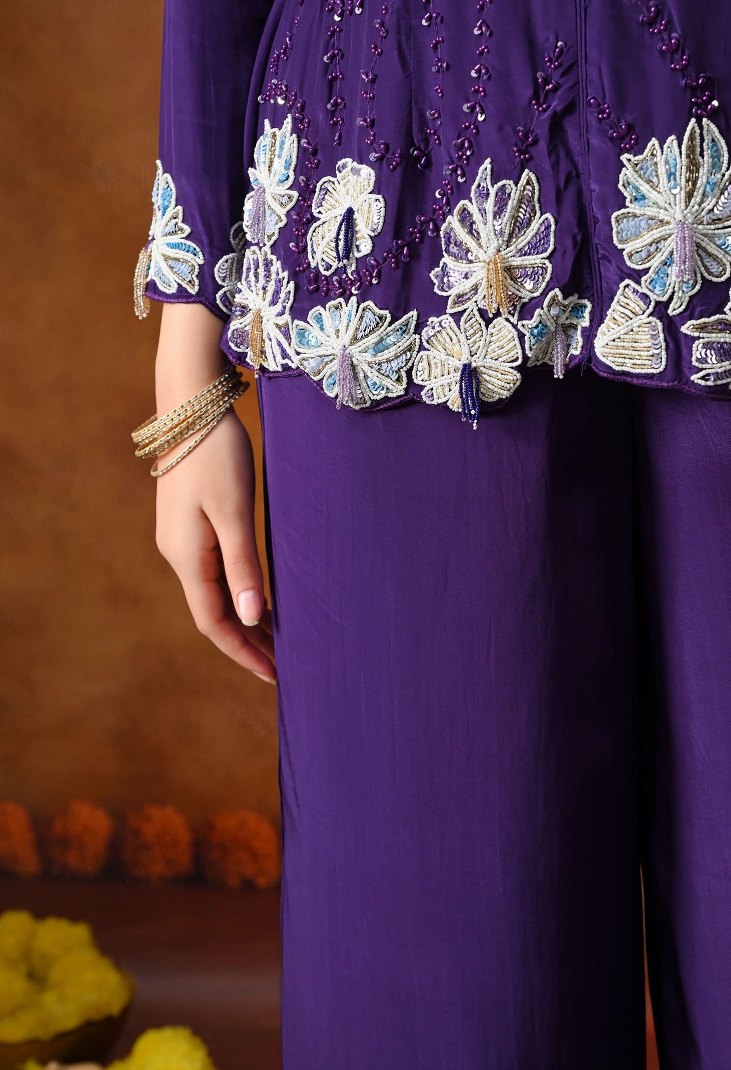 Chic purple indo western set in crepe with sequin, pearl, and cutdana work, paired with a stylish straight palazzo