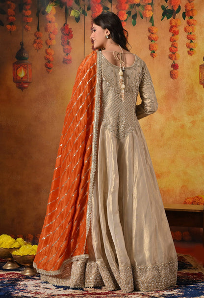 Golden Anarkali Set with Dabka, Zardozi, Pearl, and Sequin Embroidery.