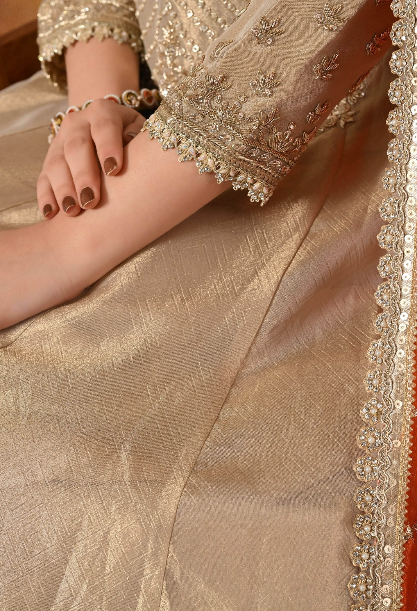 Golden Anarkali Set with Dabka, Zardozi, Pearl, and Sequin Embroidery.