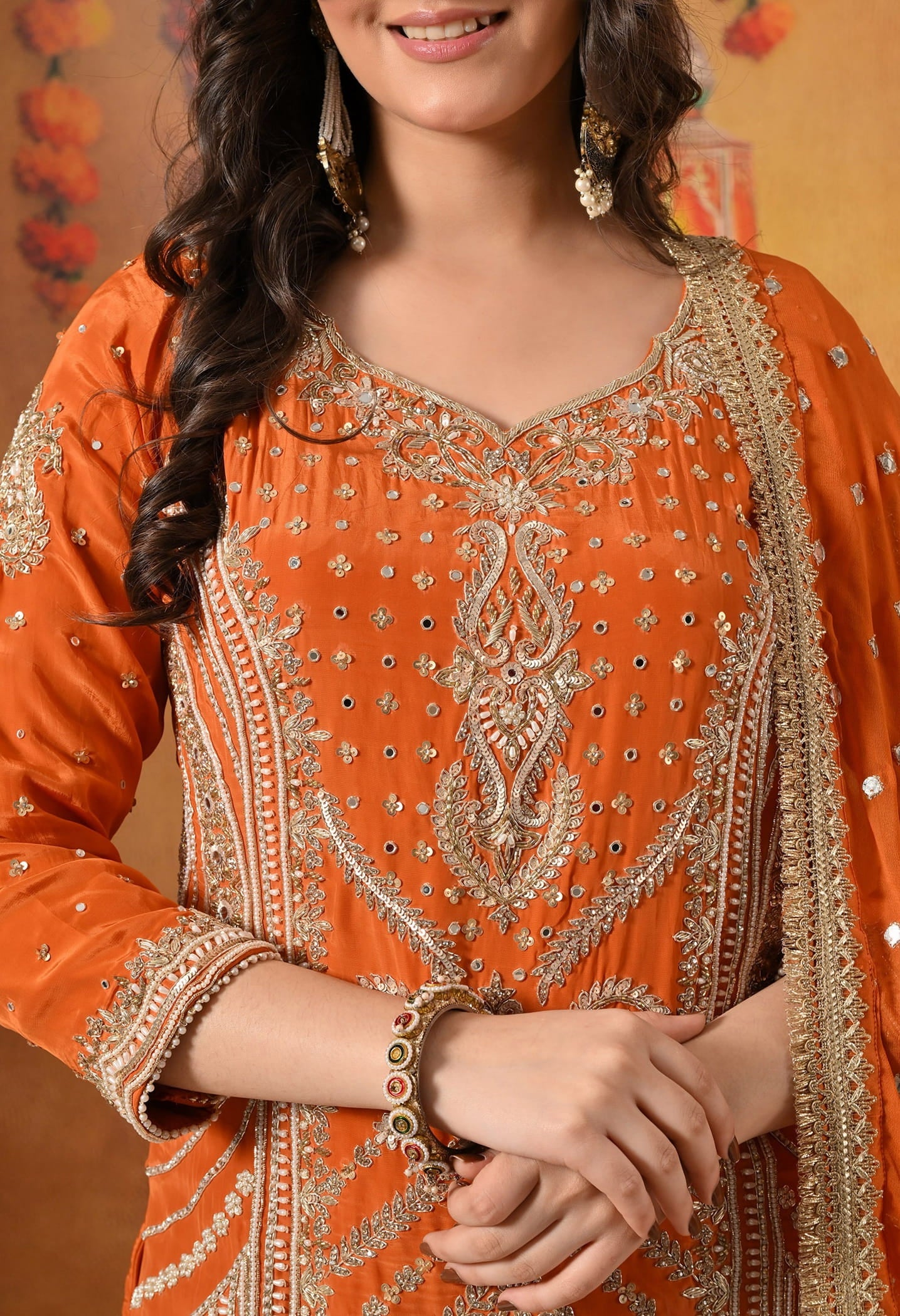 Orange Gharara Set crafted with Zardozi, Sequin, Mirror, and Pearl work.