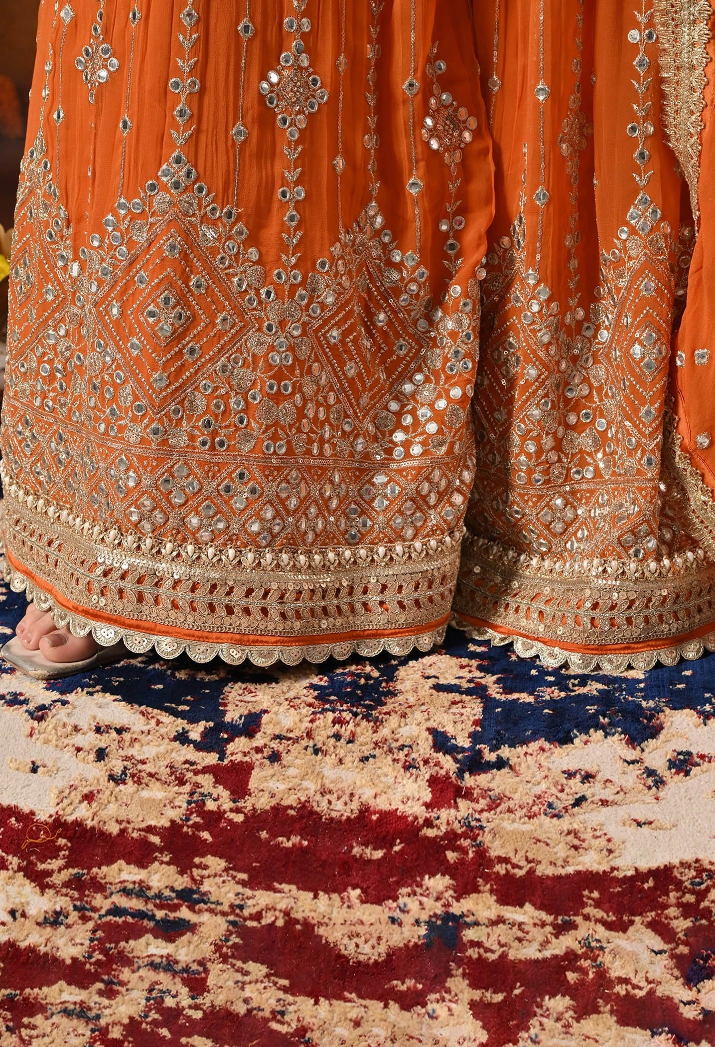 Orange Gharara Set crafted with Zardozi, Sequin, Mirror, and Pearl work.