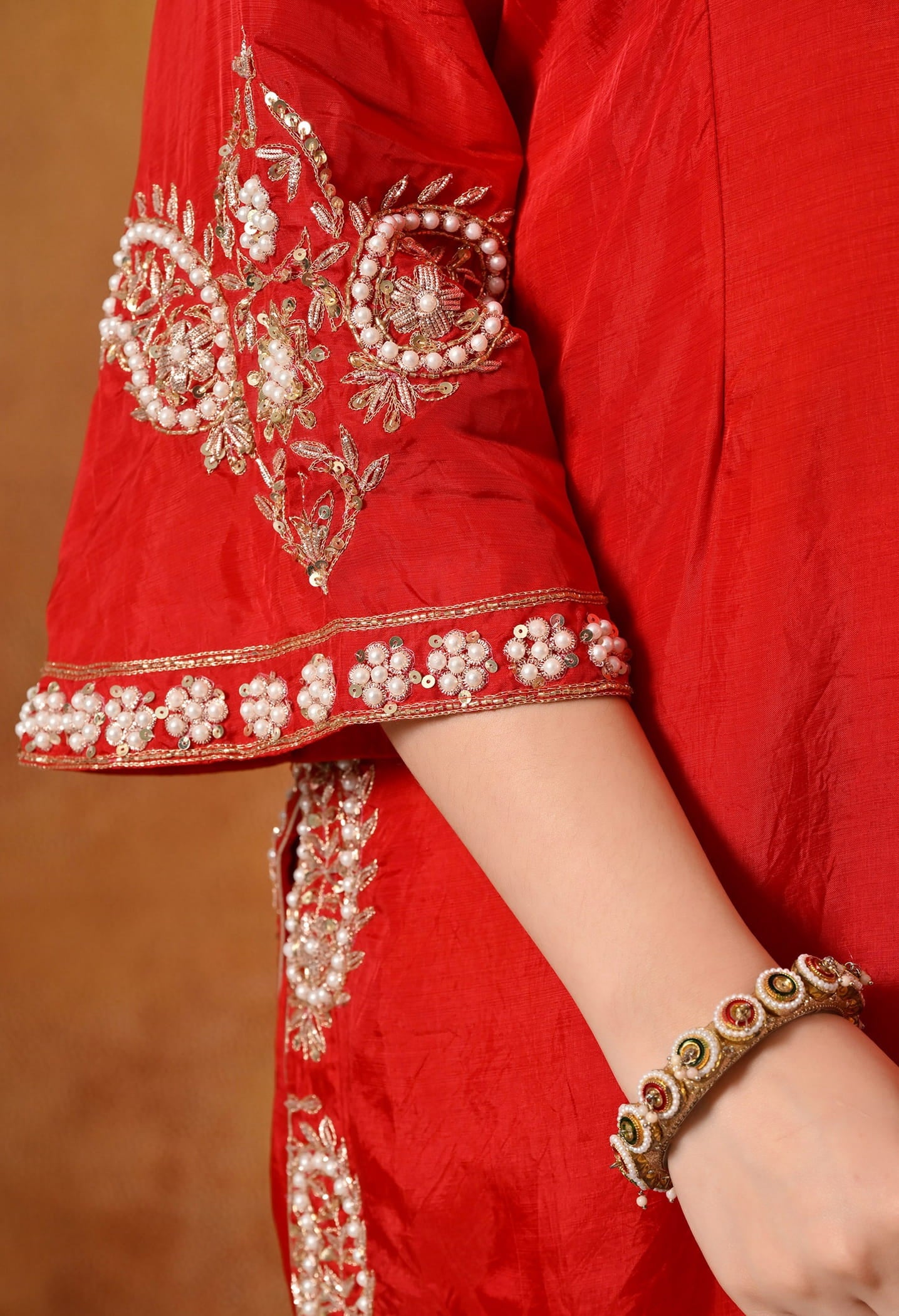 Red Kurta Set with Zardozi, Pearl, Dabka, and Sequin work.