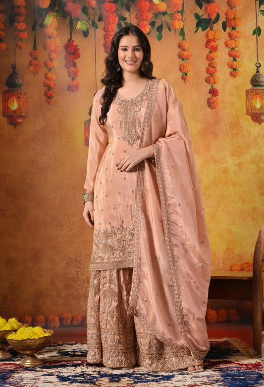 Peach Sharara Set with intricate zardozi, cutdana, crystal, and thread embroidery.