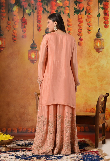 Dark Peach Sharara Set with Pearl, Zardozi, Sequin, and Cutdana Embroidery.