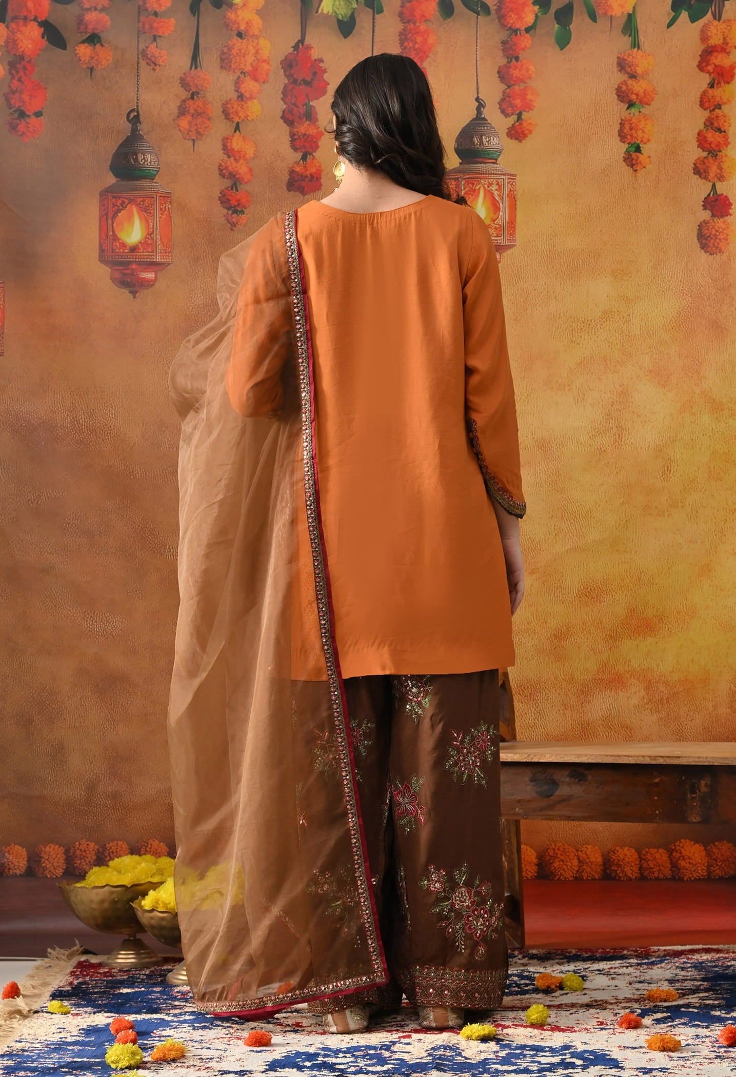 Orange Silk Kurta Set with intricate thread, sequin, and zardozi work, paired with a brown farshi salwar and net dupatta