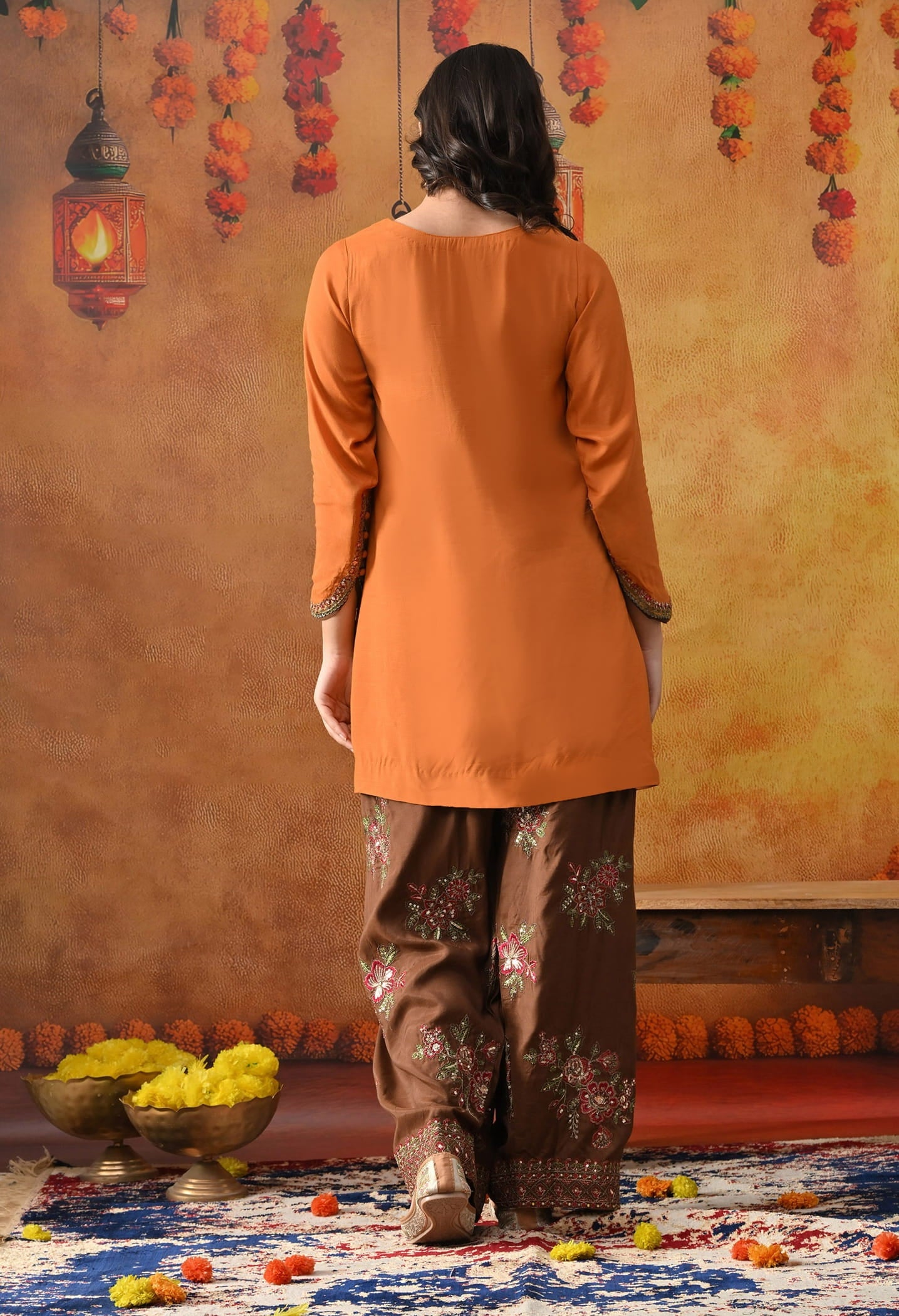 Orange Silk Kurta Set with intricate thread, sequin, and zardozi work, paired with a brown farshi salwar and net dupatta