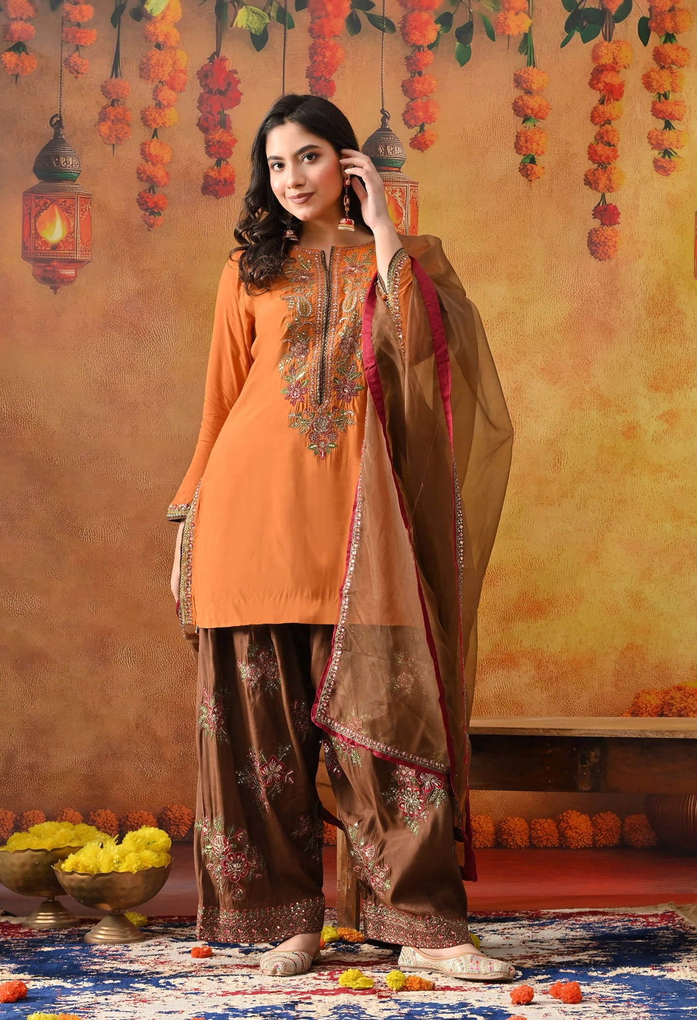 Orange Silk Kurta Set with intricate thread, sequin, and zardozi work, paired with a brown farshi salwar and net dupatta