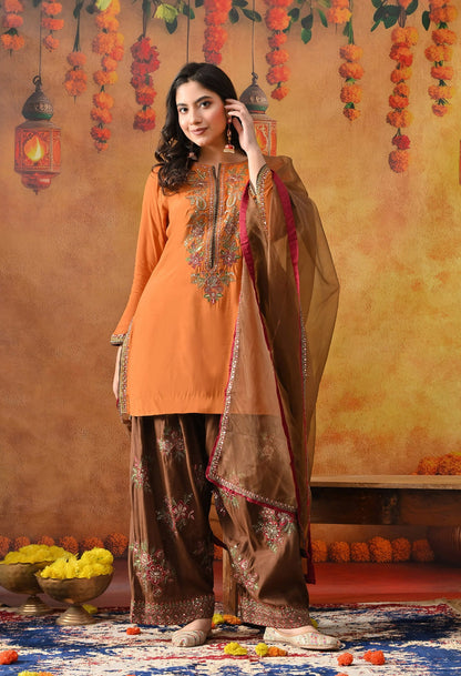 Orange Silk Kurta Set with intricate thread, sequin, and zardozi work, paired with a brown farshi salwar and net dupatta