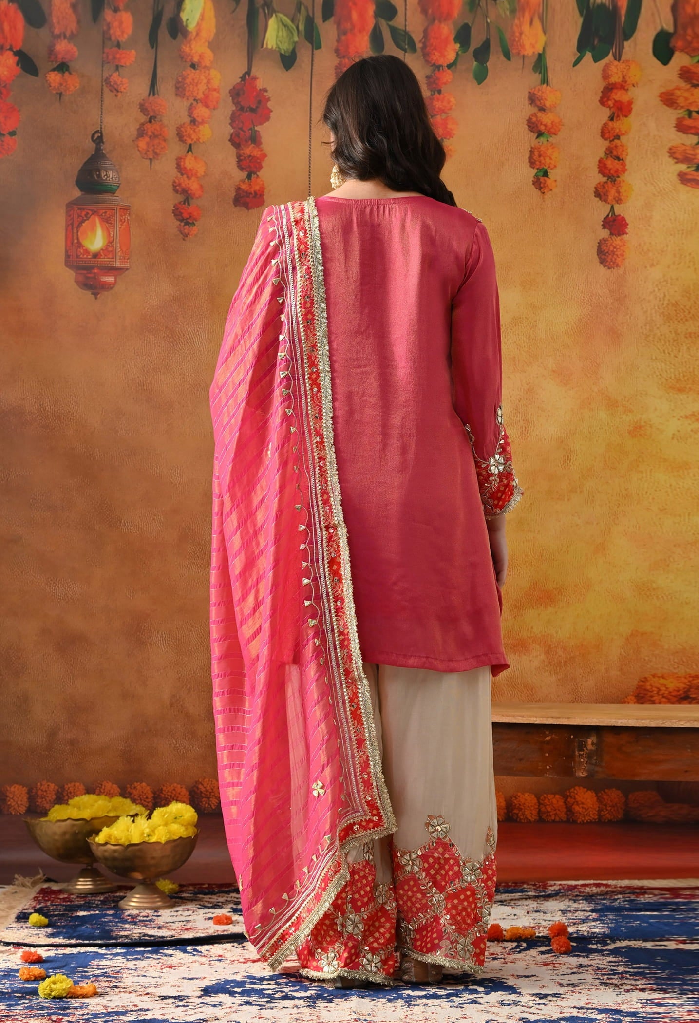 Pink Tissue Silk Kurta Set with intricate gotta and zardozi work, paired with a tissue organza dupatta and golden farshi salwar.