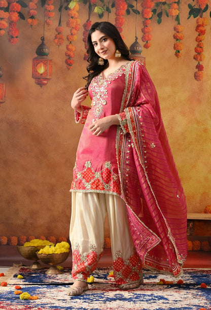 Pink Tissue Silk Kurta Set with intricate gotta and zardozi work, paired with a tissue organza dupatta and golden farshi salwar.