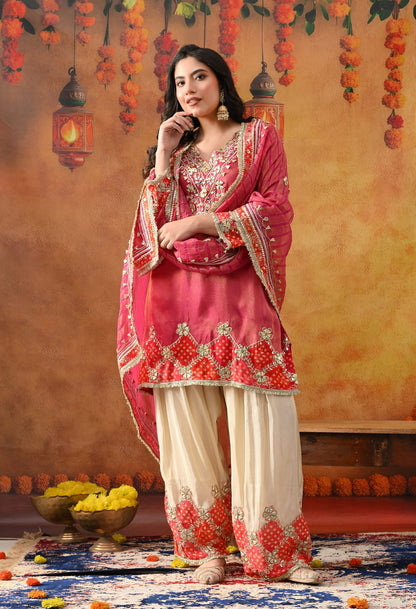 Pink Tissue Silk Kurta Set with intricate gotta and zardozi work, paired with a tissue organza dupatta and golden farshi salwar.