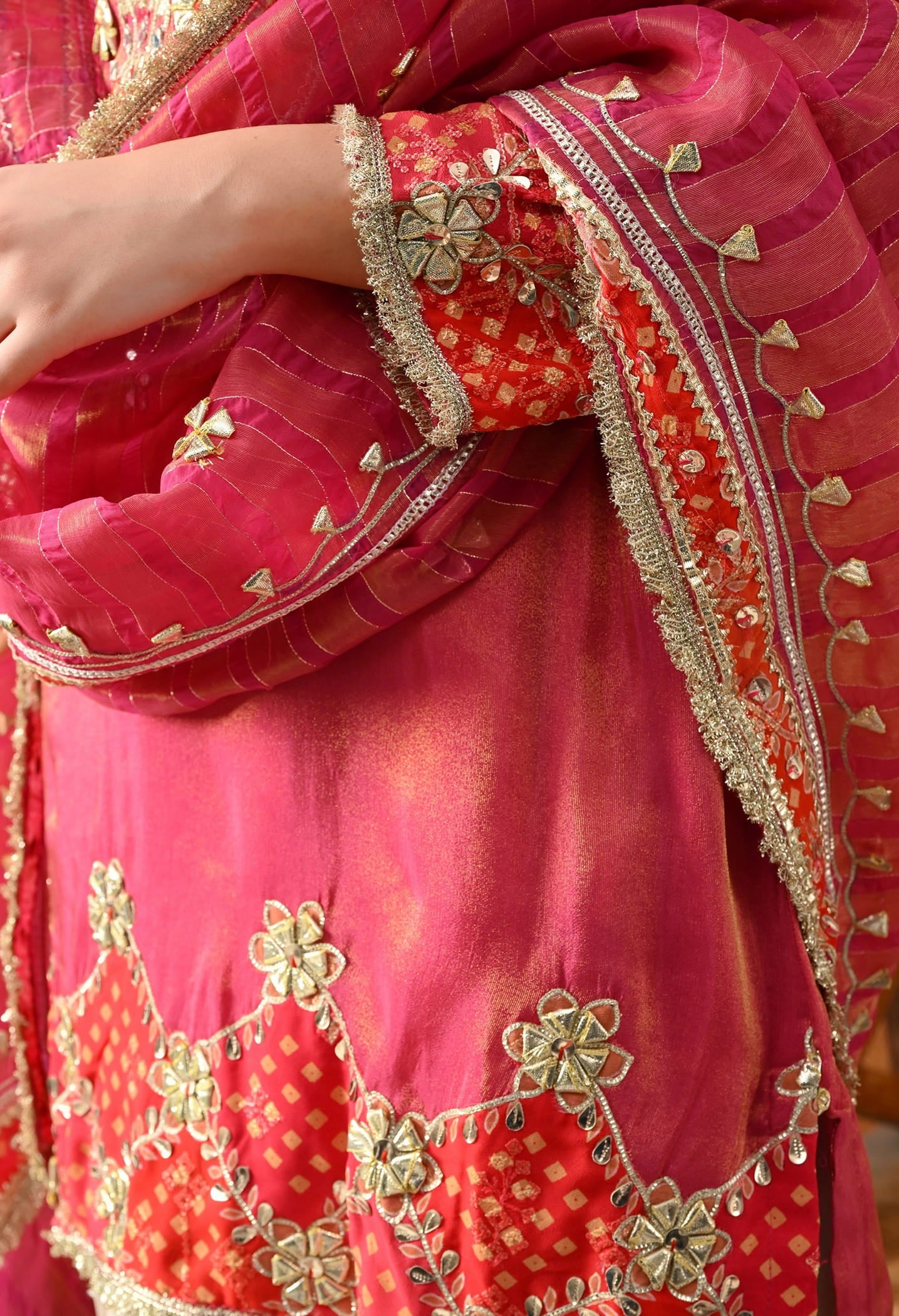 Pink Tissue Silk Kurta Set with intricate gotta and zardozi work, paired with a tissue organza dupatta and golden farshi salwar.