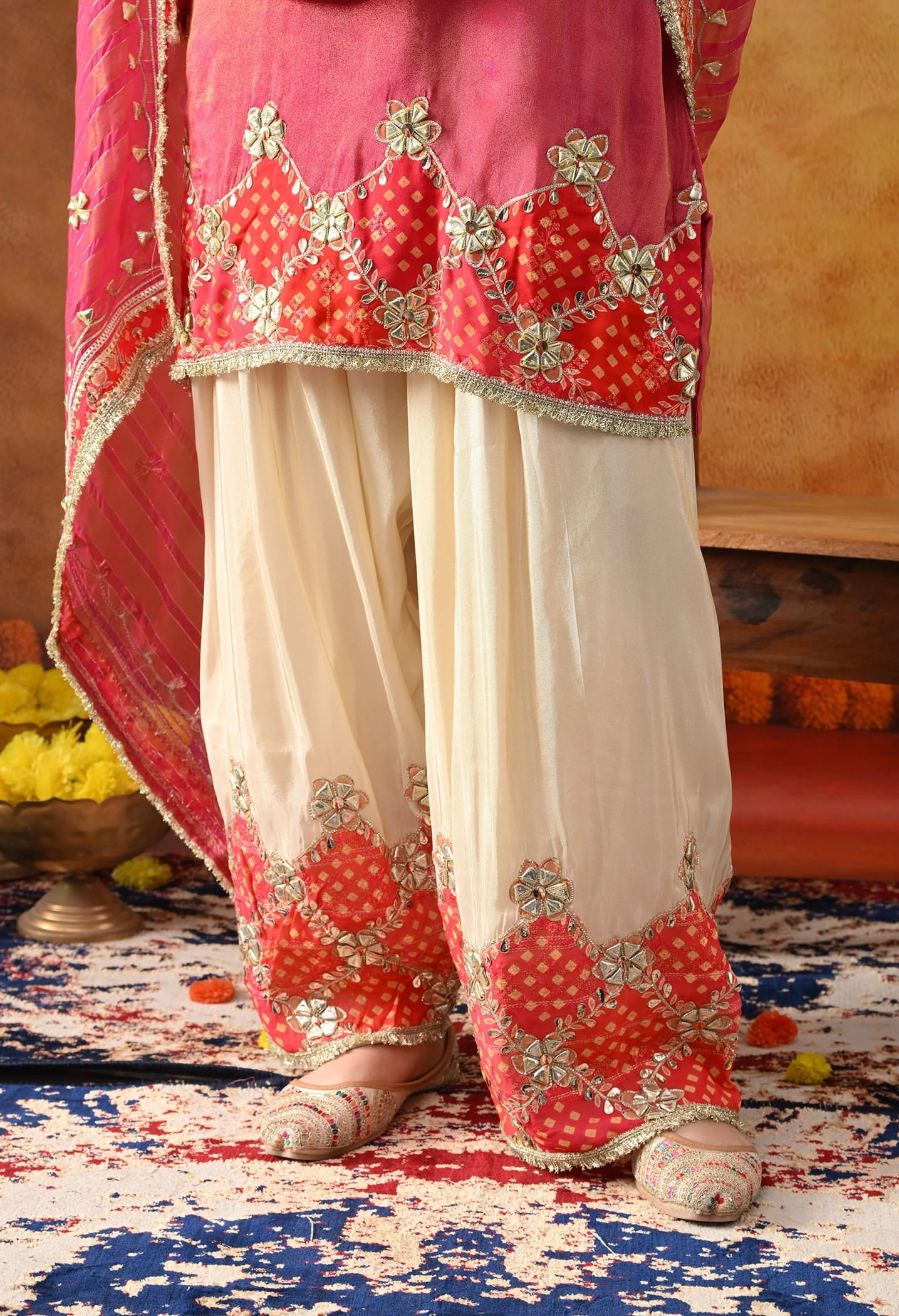 Pink Tissue Silk Kurta Set with intricate gotta and zardozi work, paired with a tissue organza dupatta and golden farshi salwar.