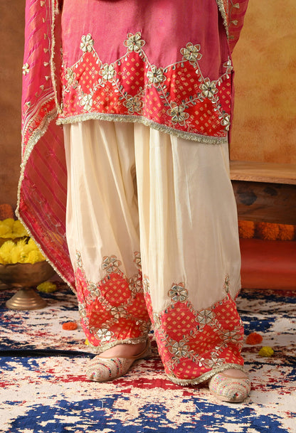 Pink Tissue Silk Kurta Set with intricate gotta and zardozi work, paired with a tissue organza dupatta and golden farshi salwar.
