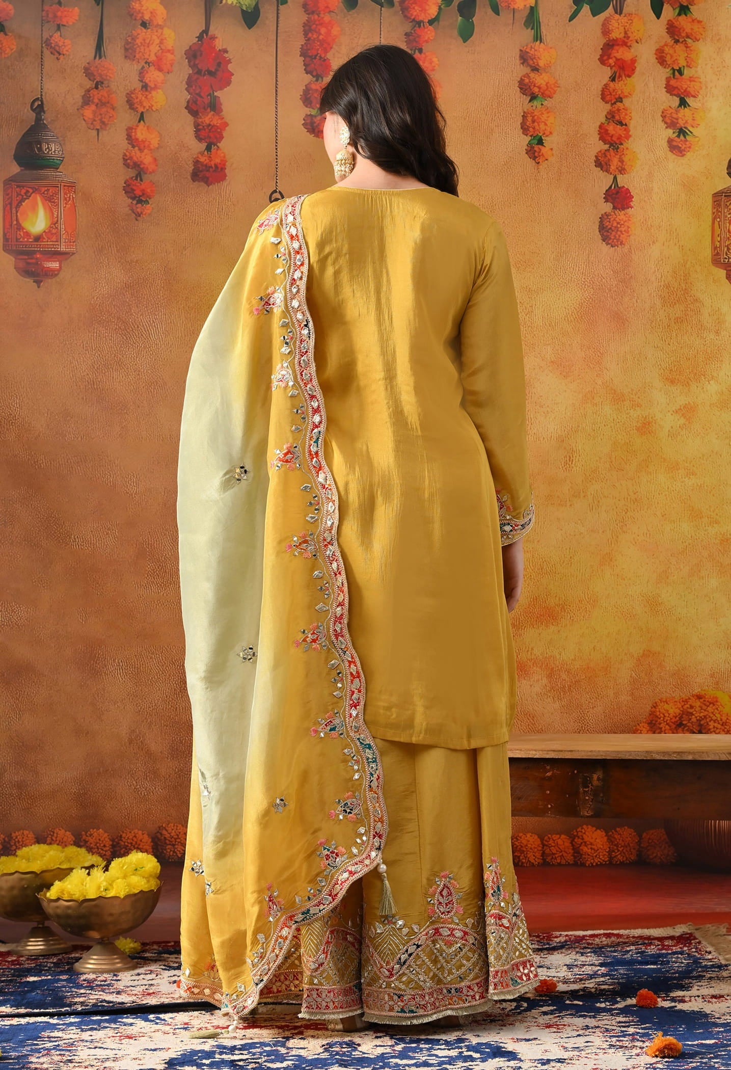 Yellow Tissue Crepe Sharara Set with intricate gotta, zardozi, applique, thread, and mirror work, paired with a dual-tone yellow and green dupatta