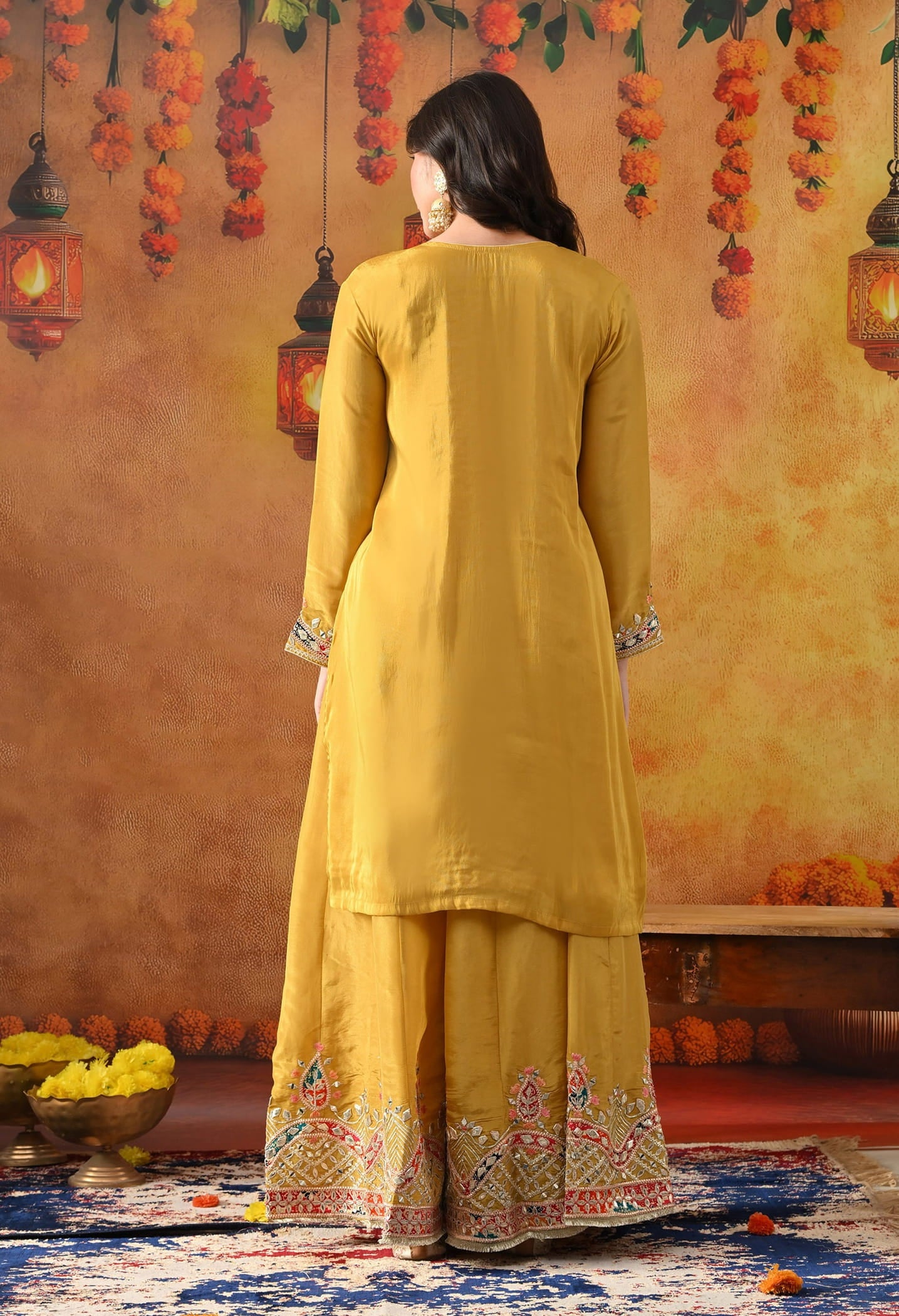 Yellow Tissue Crepe Sharara Set with intricate gotta, zardozi, applique, thread, and mirror work, paired with a dual-tone yellow and green dupatta
