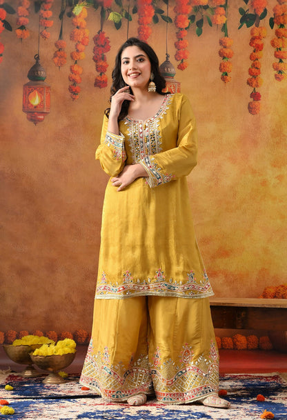 Yellow Tissue Crepe Sharara Set with intricate gotta, zardozi, applique, thread, and mirror work, paired with a dual-tone yellow and green dupatta