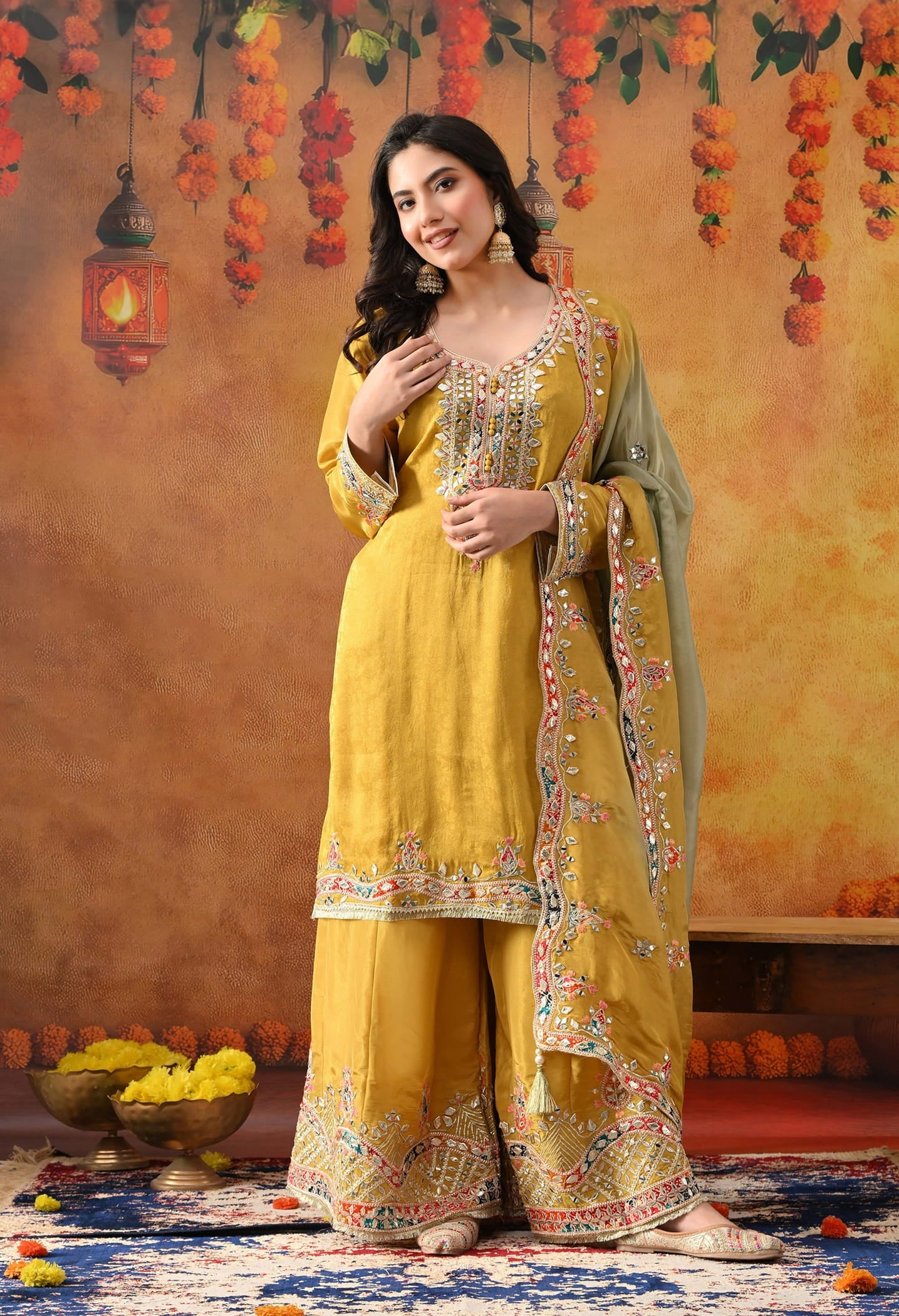 Yellow Tissue Crepe Sharara Set with intricate gotta, zardozi, applique, thread, and mirror work, paired with a dual-tone yellow and green dupatta