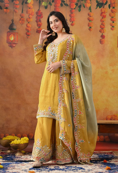 Yellow Tissue Crepe Sharara Set with intricate gotta, zardozi, applique, thread, and mirror work, paired with a dual-tone yellow and green dupatta