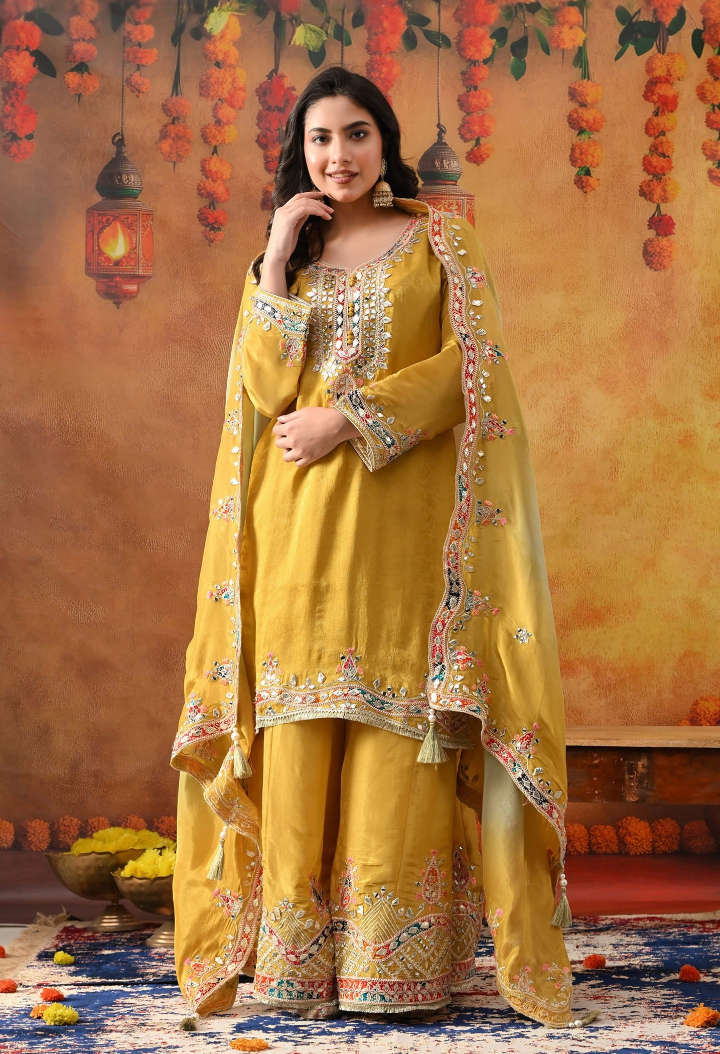 Yellow Tissue Crepe Sharara Set with intricate gotta, zardozi, applique, thread, and mirror work, paired with a dual-tone yellow and green dupatta