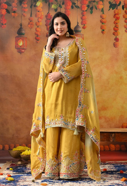 Yellow Tissue Crepe Sharara Set with intricate gotta, zardozi, applique, thread, and mirror work, paired with a dual-tone yellow and green dupatta