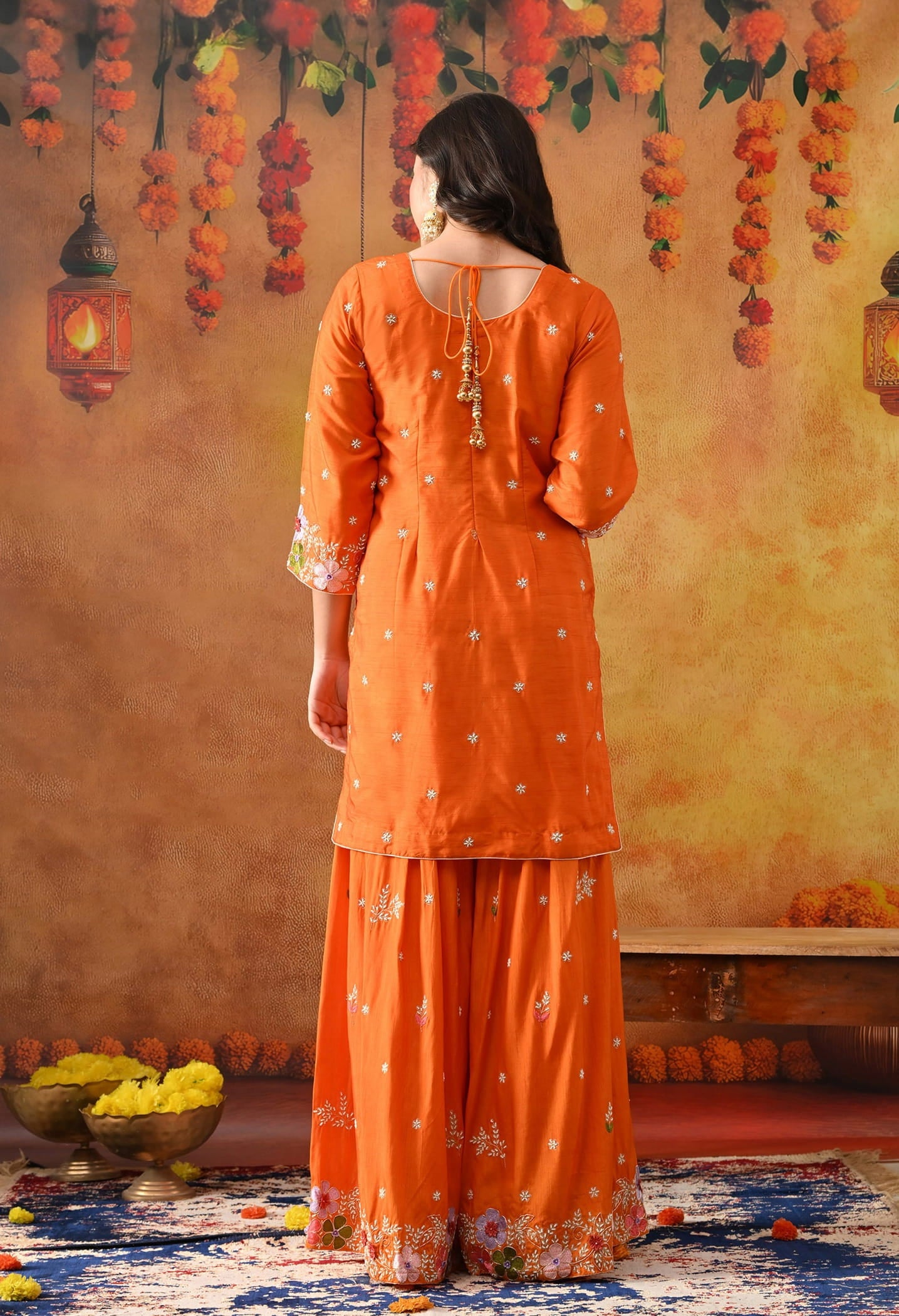 Orange Silk Gharara Set with intricate thread, pearl, and zardozi work, paired with an organza dupatta.