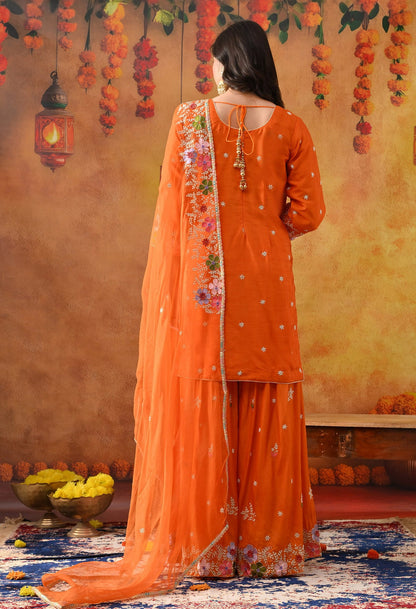 Orange Silk Gharara Set with intricate thread, pearl, and zardozi work, paired with an organza dupatta.