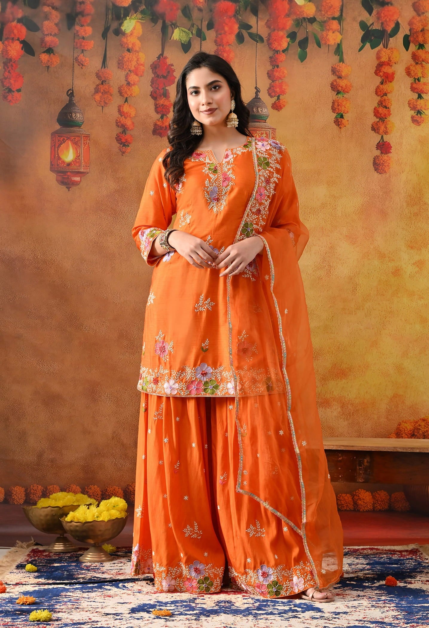 Orange Silk Gharara Set with intricate thread, pearl, and zardozi work, paired with an organza dupatta.