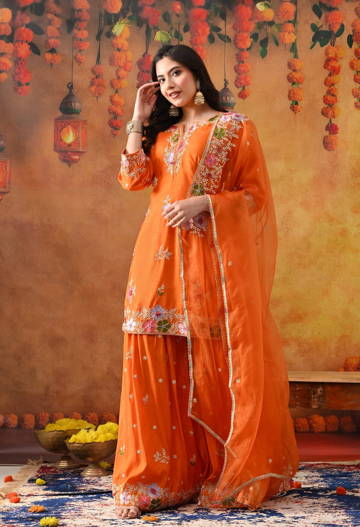 Orange Silk Gharara Set with intricate thread, pearl, and zardozi work, paired with an organza dupatta.