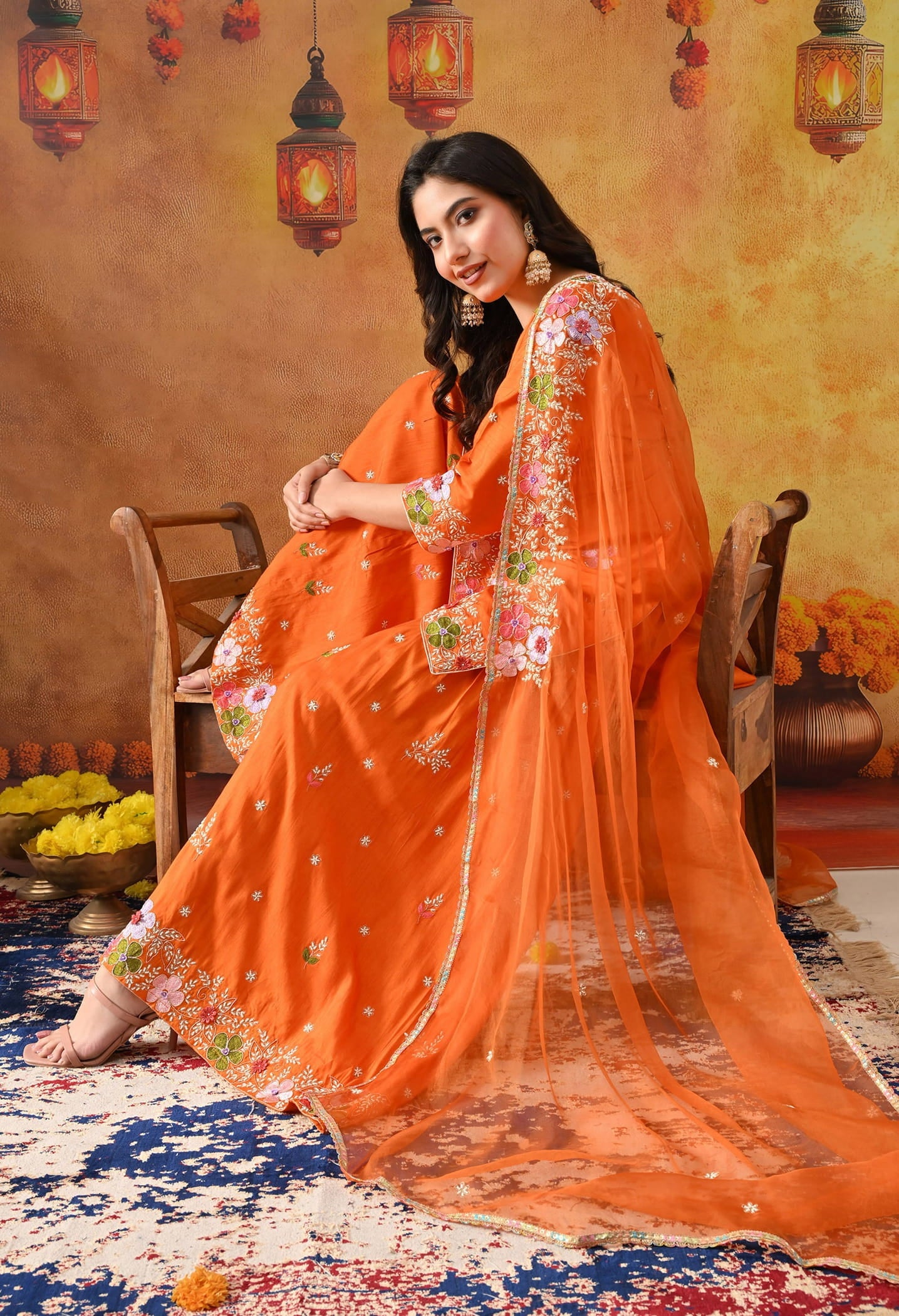 Orange Silk Gharara Set with intricate thread, pearl, and zardozi work, paired with an organza dupatta.