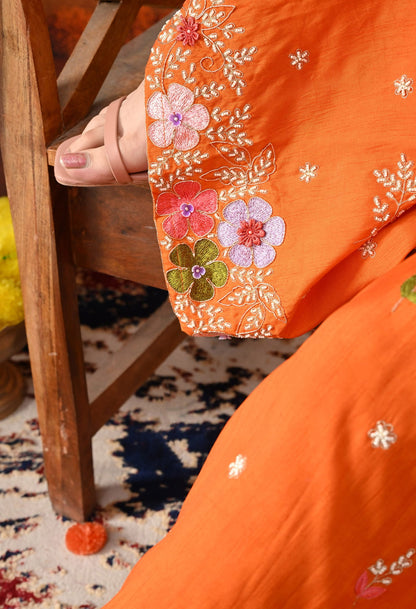 Orange Silk Gharara Set with intricate thread, pearl, and zardozi work, paired with an organza dupatta.