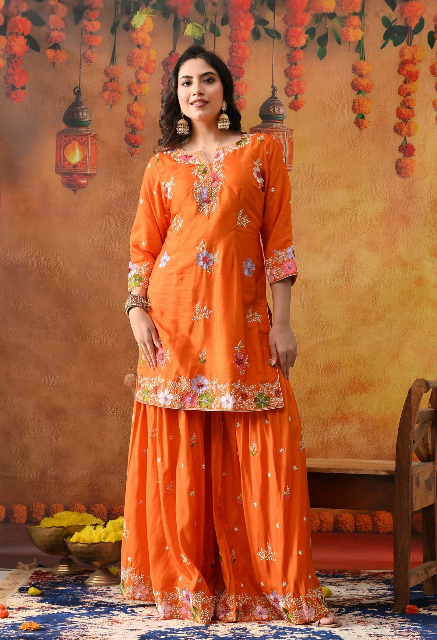 Orange Silk Gharara Set with intricate thread, pearl, and zardozi work, paired with an organza dupatta.