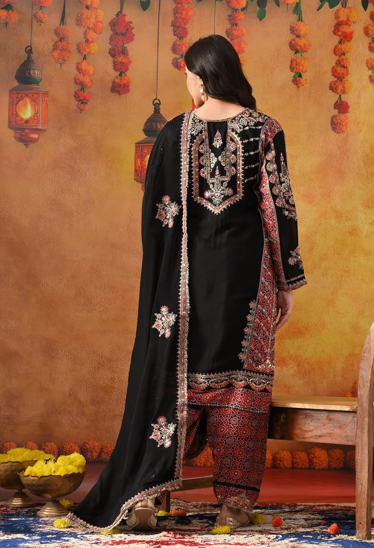 Black Chinon Kurta Set with intricate zardozi, thread, pearl, and sequin work, paired with a pink printed dupatta and matching salwar