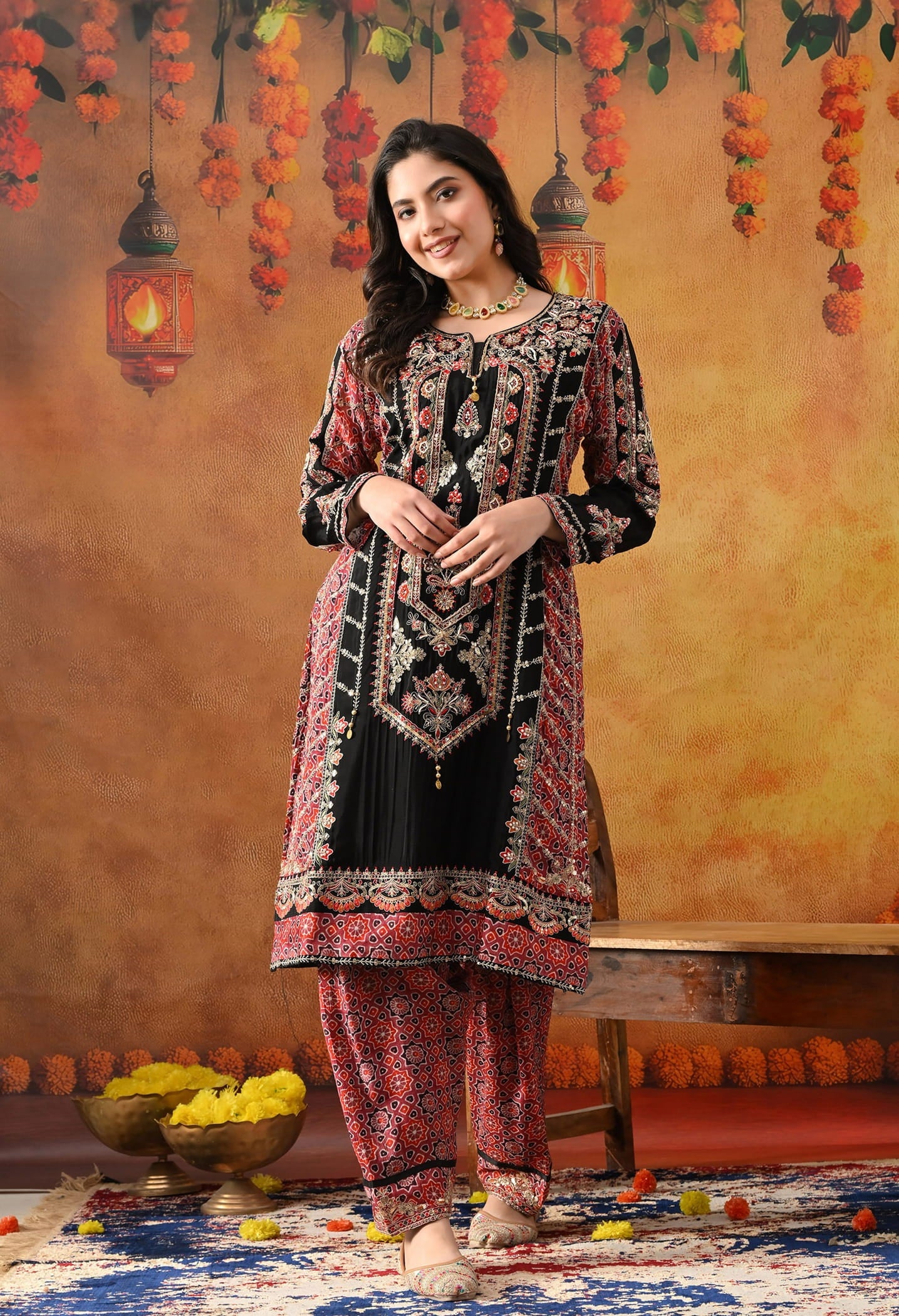 Black Chinon Kurta Set with intricate zardozi, thread, pearl, and sequin work, paired with a pink printed dupatta and matching salwar