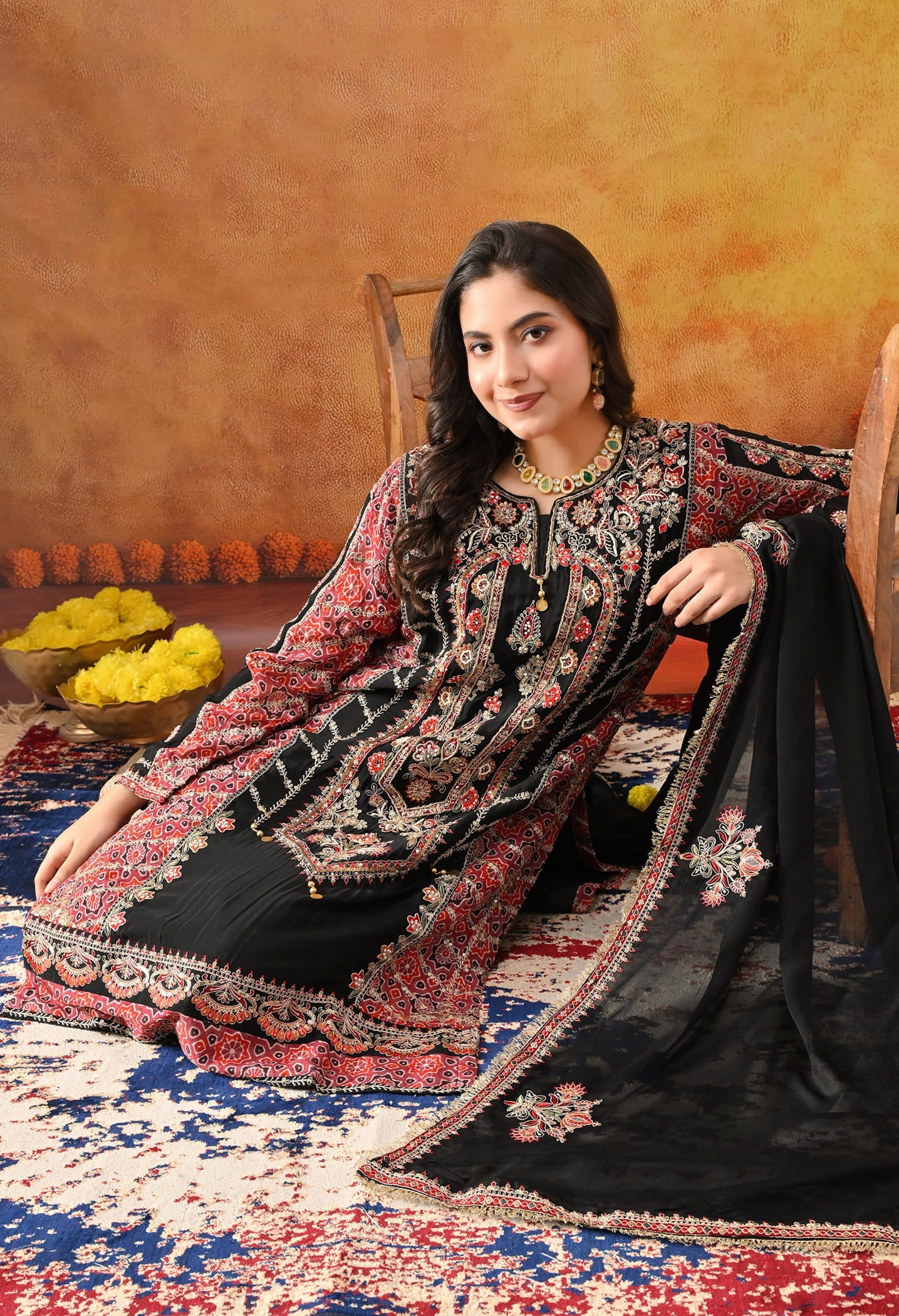 Black Chinon Kurta Set with intricate zardozi, thread, pearl, and sequin work, paired with a pink printed dupatta and matching salwar