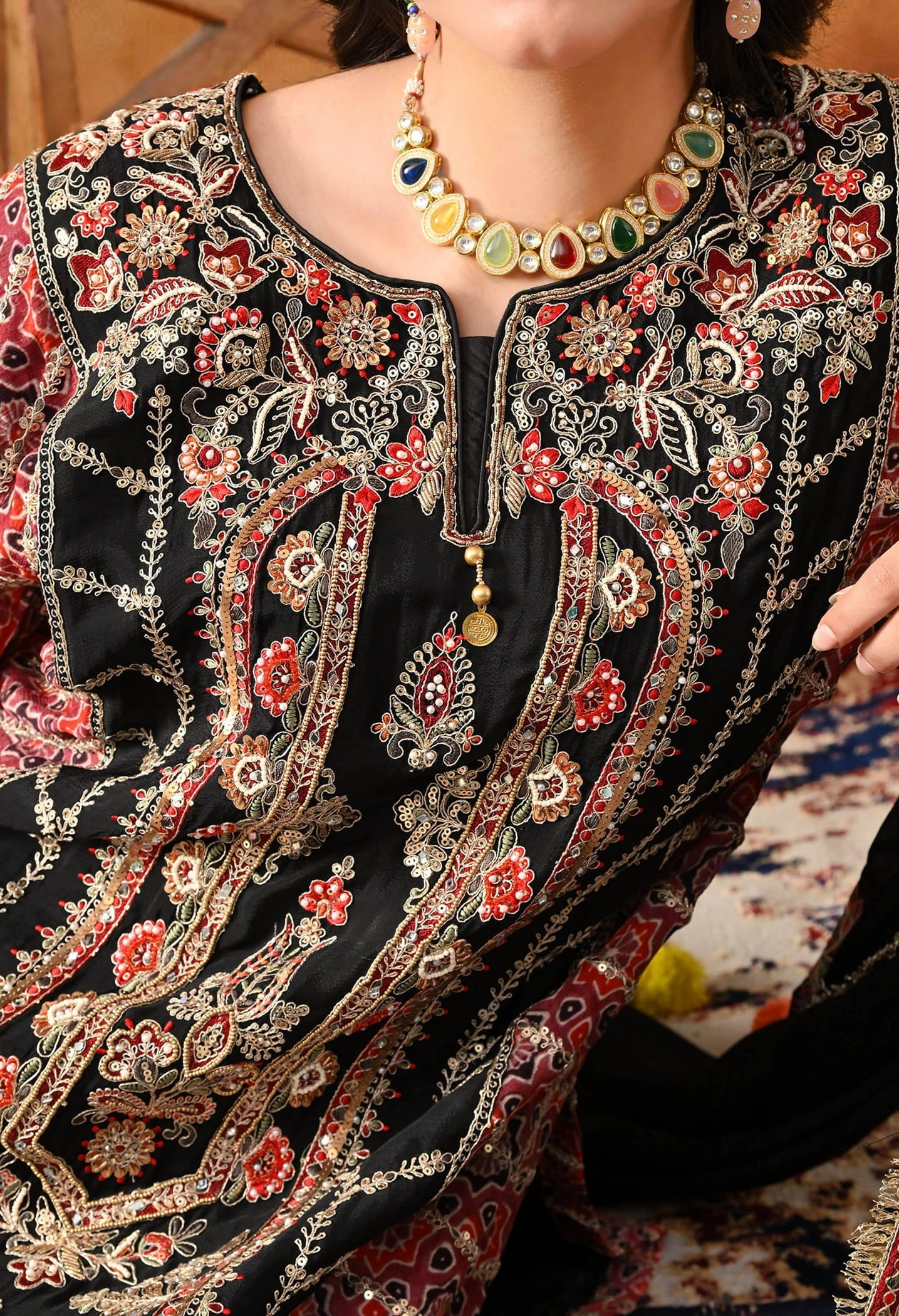 Black Chinon Kurta Set with intricate zardozi, thread, pearl, and sequin work, paired with a pink printed dupatta and matching salwar