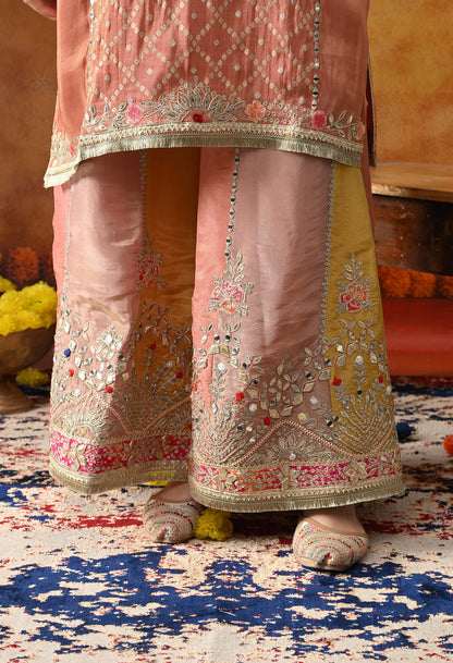 Creamy Peach Tissue Crepe Sharara Set with intricate gotta, zardozi, applique, and thread work, paired with a multicolour sharara and matching dupatta