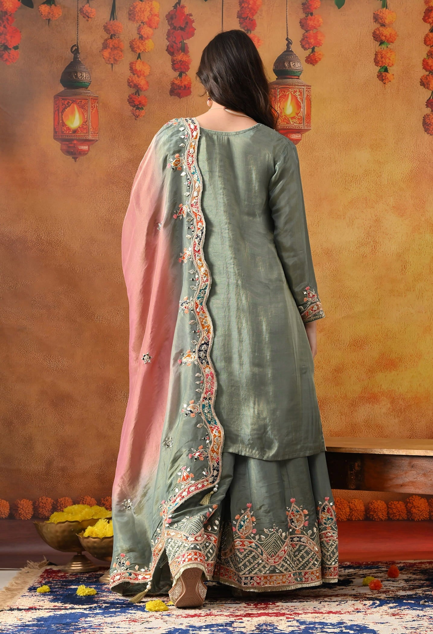 Mint Green Tissue Crepe Sharara Set with intricate gotta, zardozi, applique, thread, and mirror work, paired with a pink and green dupatta