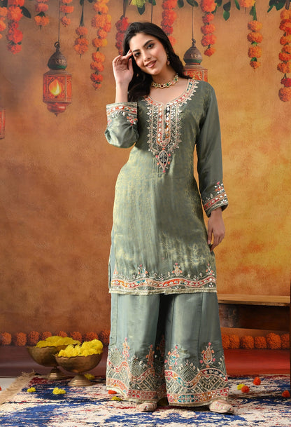 Mint Green Tissue Crepe Sharara Set with intricate gotta, zardozi, applique, thread, and mirror work, paired with a pink and green dupatta
