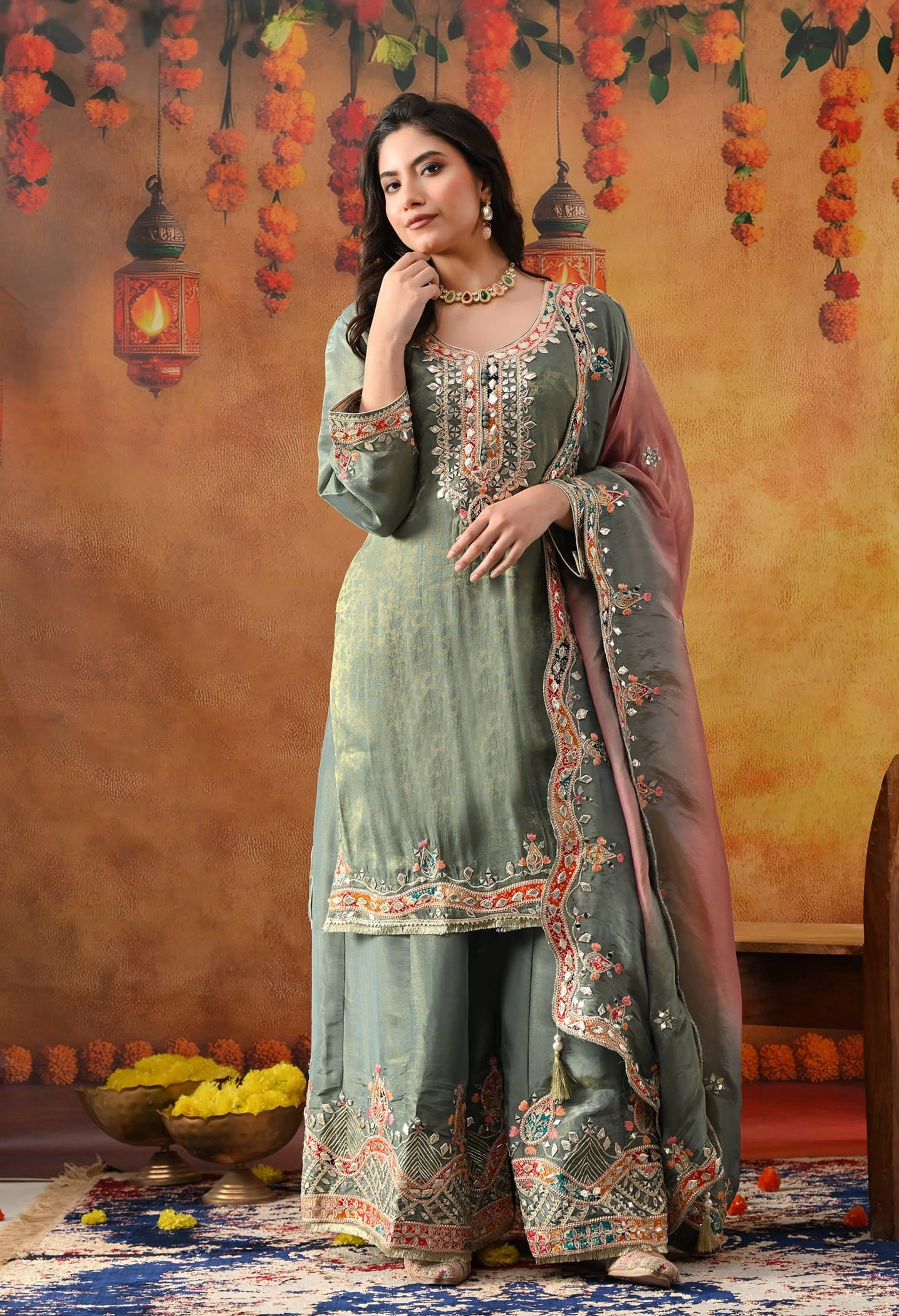 Mint Green Tissue Crepe Sharara Set with intricate gotta, zardozi, applique, thread, and mirror work, paired with a pink and green dupatta