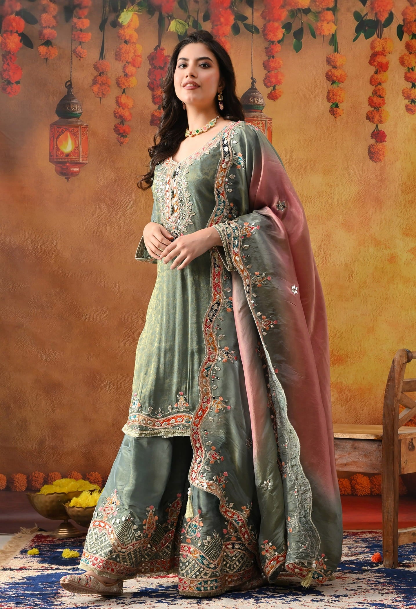 Mint Green Tissue Crepe Sharara Set with intricate gotta, zardozi, applique, thread, and mirror work, paired with a pink and green dupatta