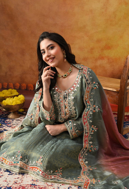 Mint Green Tissue Crepe Sharara Set with intricate gotta, zardozi, applique, thread, and mirror work, paired with a pink and green dupatta