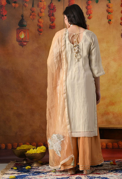Golden Sharara Set in crust tissue organza with intricate gotta, crystal, and applique work, paired with a golden brown sharara and dupatta