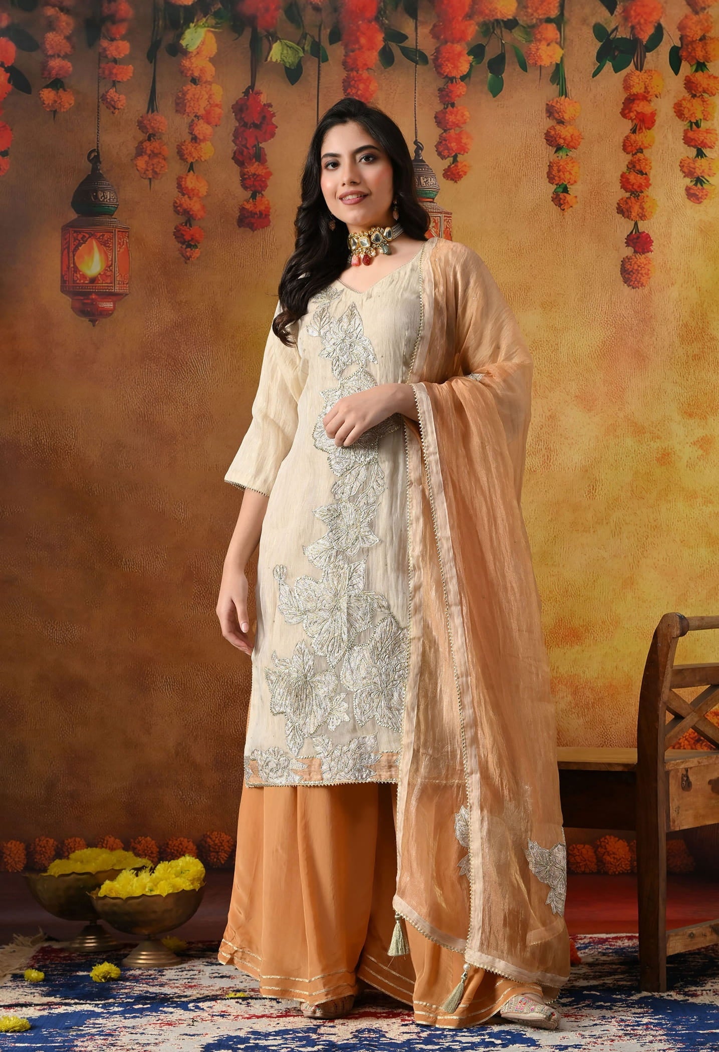 Golden Sharara Set in crust tissue organza with intricate gotta, crystal, and applique work, paired with a golden brown sharara and dupatta
