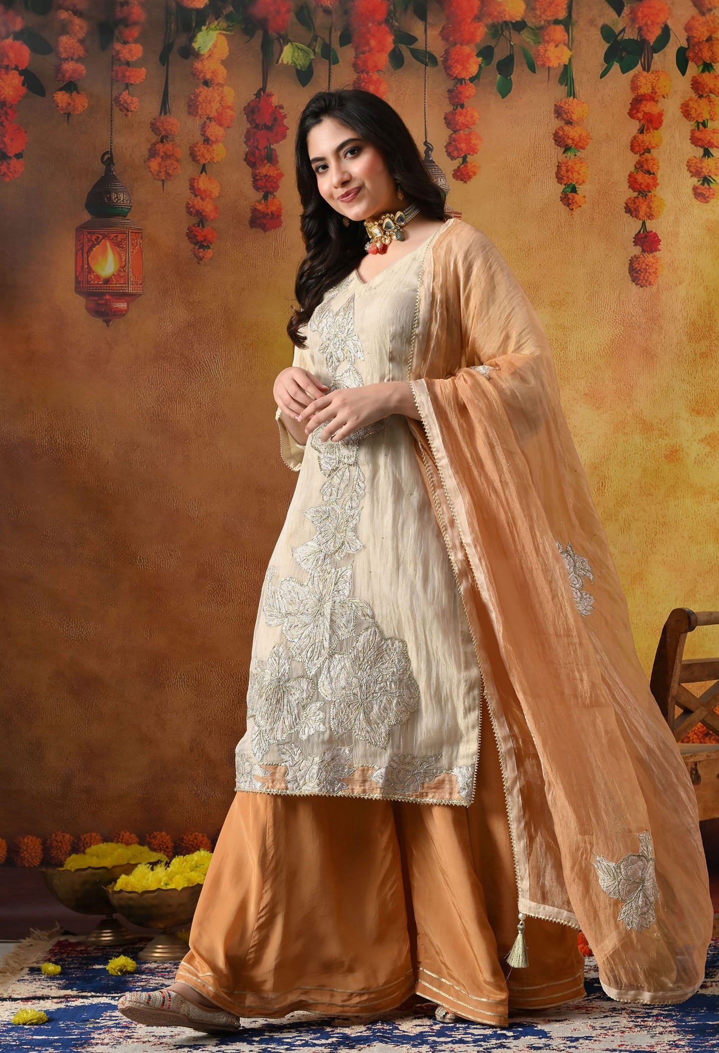 Golden Sharara Set in crust tissue organza with intricate gotta, crystal, and applique work, paired with a golden brown sharara and dupatta