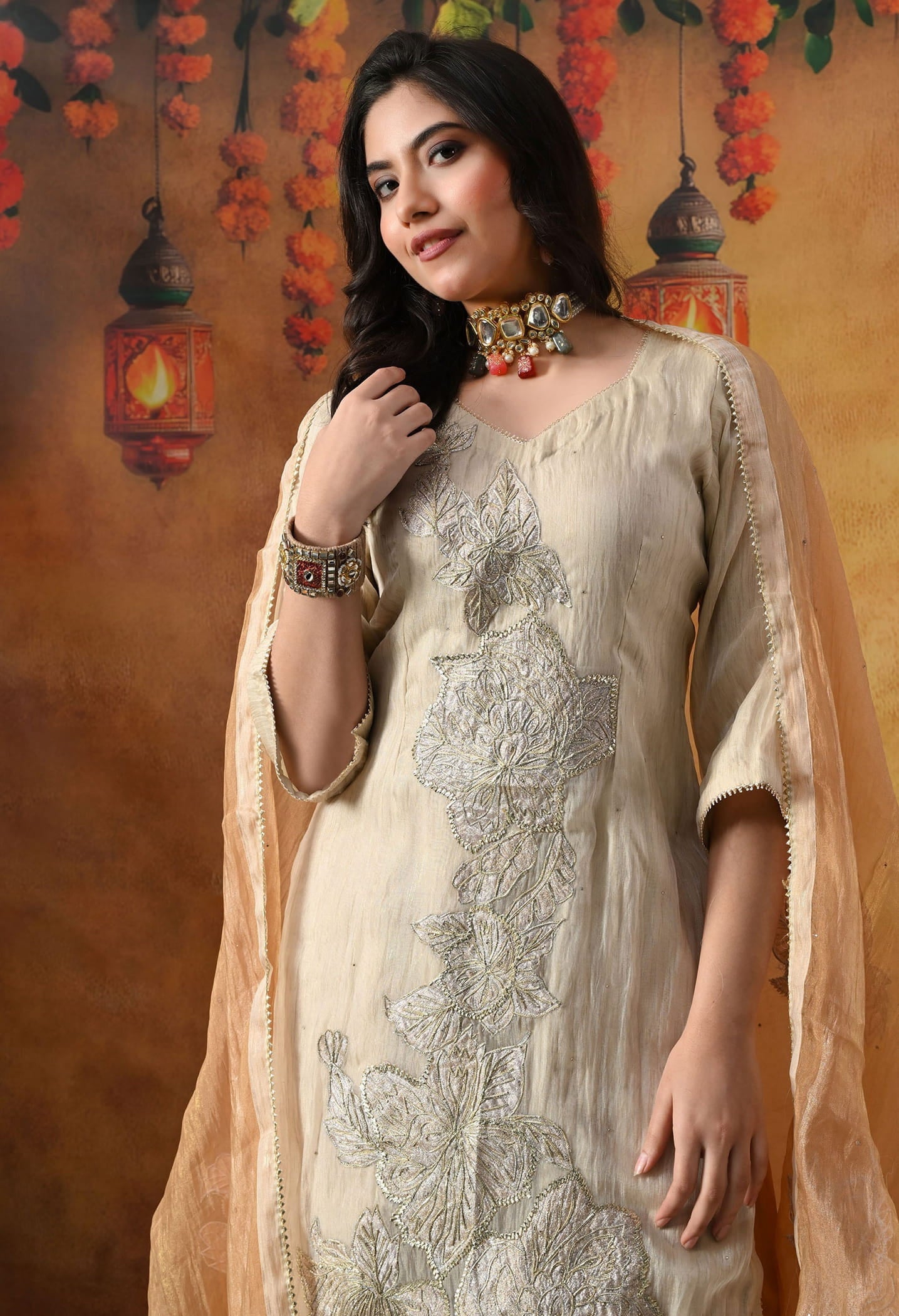 Golden Sharara Set in crust tissue organza with intricate gotta, crystal, and applique work, paired with a golden brown sharara and dupatta